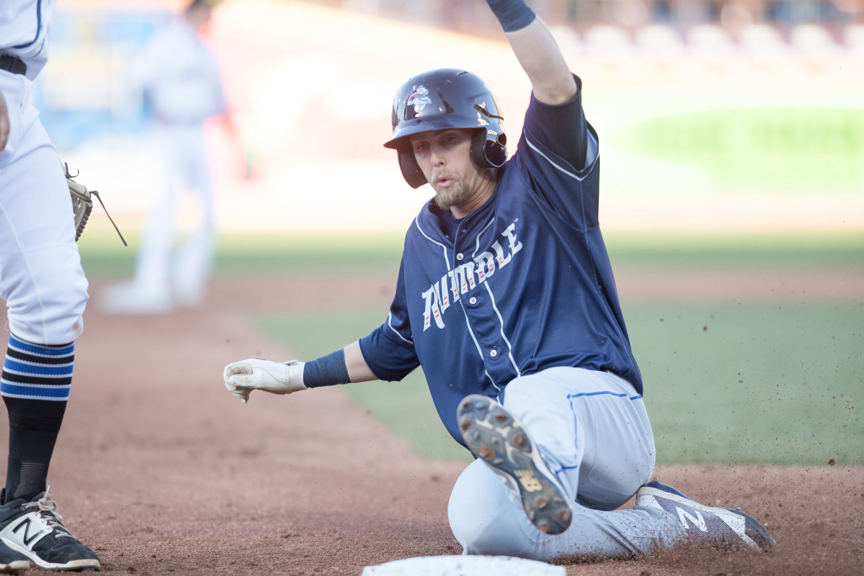 McNeil slides safely